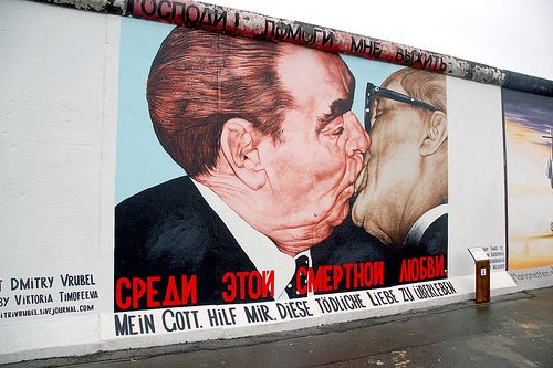 The most well-known image in the East Side Gallery (what is remaining of the Berlin Wall) depicts the alliance between Soviet leader Leonid Brezhnev and the GDR’s Erich Honeckerare. The text tranlslates as, “My God, help me outlive this deadly love.” This mural and others painted by famous artists from around the world may be torn down and replaced with high-end apts if local protests are not successful.