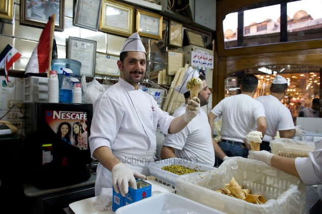 Many businesses have closed down in Syria since their civil war started more than 2 years ago.  While thousands of people have either been killed or have fled, the owner of Bakdash, an ice cream parlor in Damascus, has stayed open.  Although it is hard to get raw materials now and profits have diminished considerably, he wants to do his part to brighten everyone's mood:  "We have to keep going and look forward to better days"  and is "putting a smile and hope" into ice cream these days.