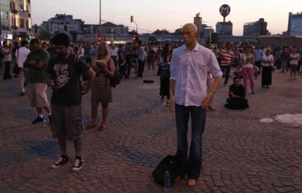 After two weeks of violent demonstrations and street battles with the police, the anti-government protest in Istanbul's Taksim Square has shifted to a silent and peaceful one.  They are now able to protest with dignity and without fear of being attacked or arrested.  Many believe that passive resistance is a better approach because government (and the rest of the public) are no longer distracted by the violence and may be more open to consideration and dialogue of the issues. actually consider the issues that are being ais no longershake up the goverpare just standing still reading books, such as George Orwell's 1984.  
