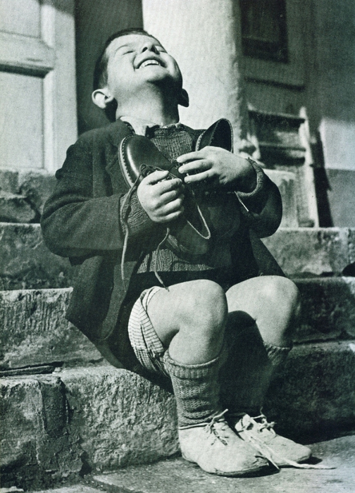 Austrian boy receives NEW shoes during World War II.