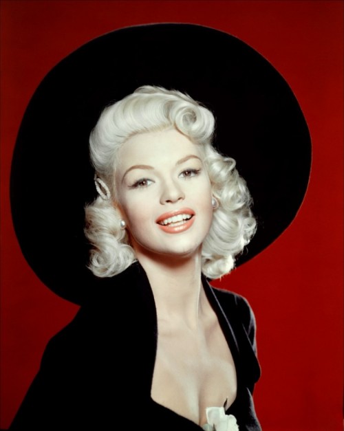 One of Hollywood's major stars in the 1950's and a former Playboy playmate, model and nightclub entertainer, Jayne Mansfield's short life was filled with controversy.   Despite the roles she played, Jayne reportedly had an IQ of 163, was a linguist, a violinist and lived for a while in a small apartment in LA with 4 dogs, 3 cats and a rabbit.  She reportedly had a romantic relationship with Anton LaVey, the founder of the Church of Satan and became a disciple of his and a practicing High Priestess Satanist. Her signature color was pink.  In 1967, she died in a car crash at the age of 34.